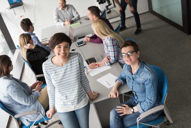 Image of smiling office staff that used Commercial Carpet Cleaning in Draper